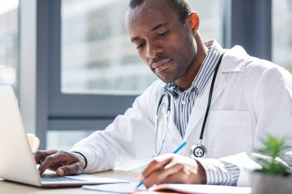 attentive medical worker making notices
